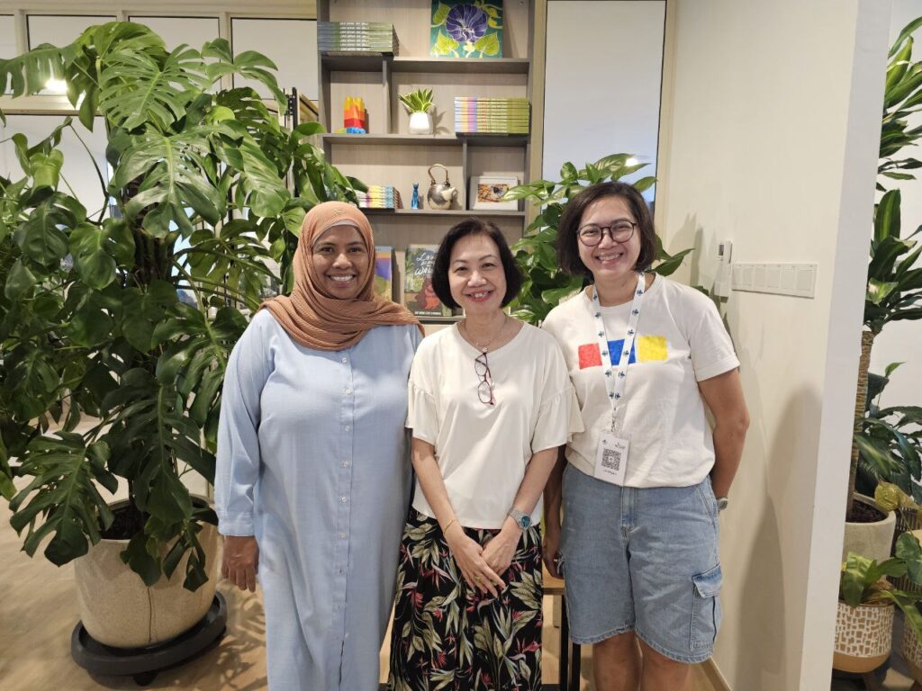 svg+xml;charset=utf Collective for a Stronger Society Stories and Resources CFS CEO Ms Catherine Loh (center) with Ms Saleemah Ismail, Founder and Executive Director of New Life Stories (left), and Ms Lin Shiyun, Founder and Executive Director of 3Pumpkins (right)