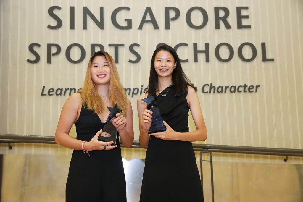 cheung kemei and jaslyn hooi holding the 2021 annabel pennefather award