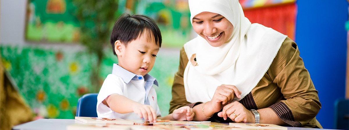 Smiling and caring women interacting with a child