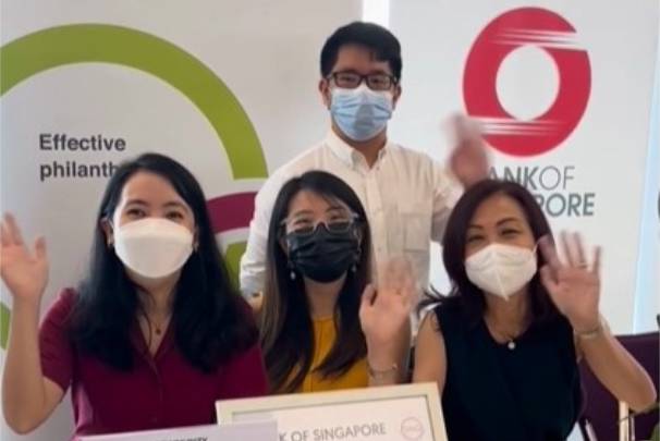 a group of people wearing face masks at OCBC sustainability day