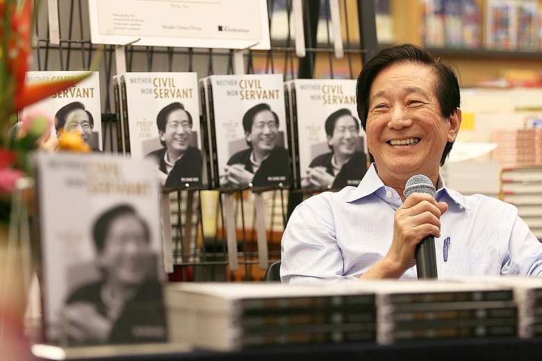 a man holding a microphone publishing his book