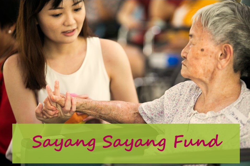 Image of Sayang Saing Fund logo. WIth a young and old lady holding hands