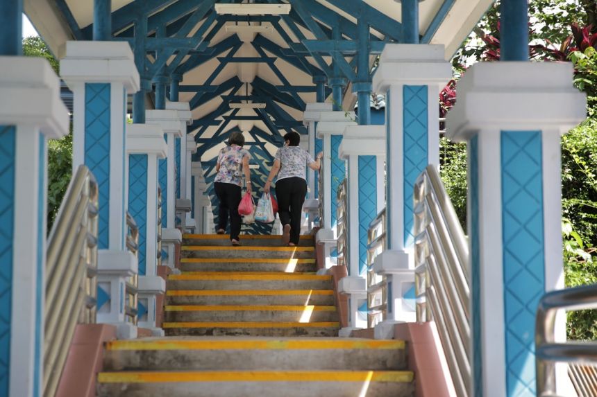 two elderly climbing up stairs