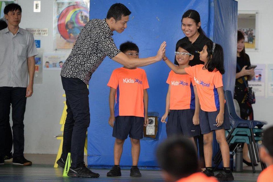 Acting MCCY Minister David Neo interacts with pupils from the KidsExcel programme run by the charity, Catch Them Young. ST PHOTO: NG SOR LUAN