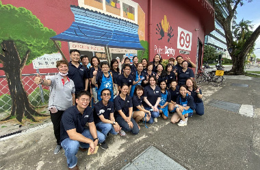 A group of diverse individuals posing for a photo