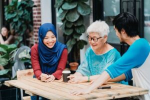 people of different races and ages socializing and catching up at a local cafe.