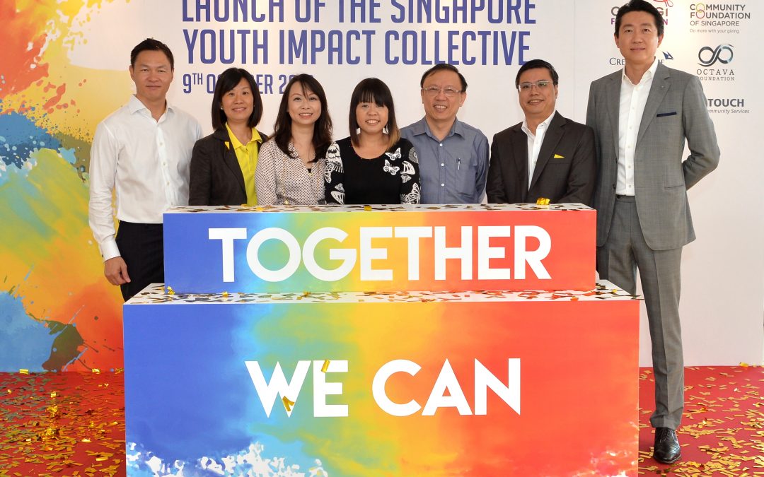 A group of people posing (From left) James Tan, Tan-Wu Mei Ling, Justina Tan, Joyce Teo, Dr Ang Kiam Wee, Pang Sze Khai and Jacky Ang
