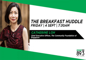 The breakfast huddle with Catherine Loh: A group of individuals gathered around a table, engaged in a morning discussion.