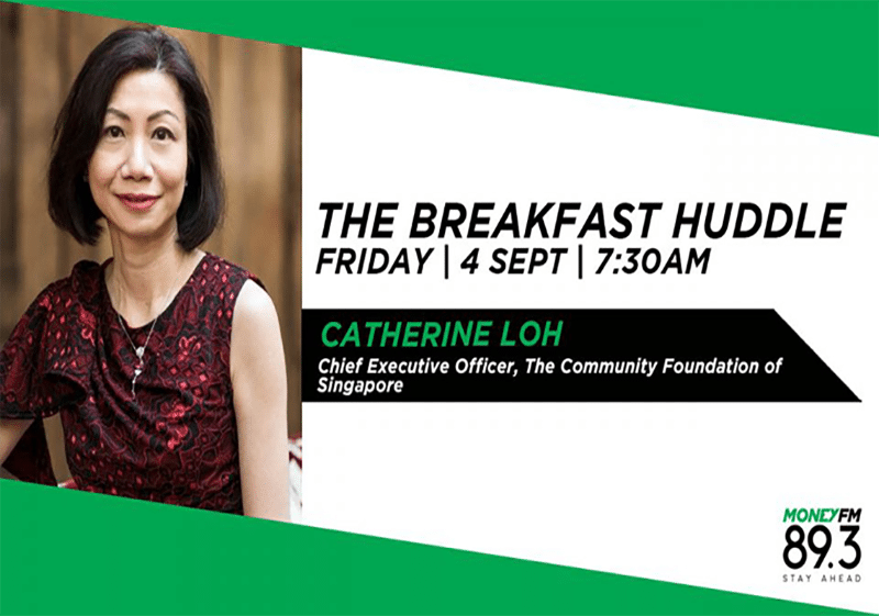 The breakfast huddle with Catherine Loh: A group of individuals gathered around a table, engaged in a morning discussion.