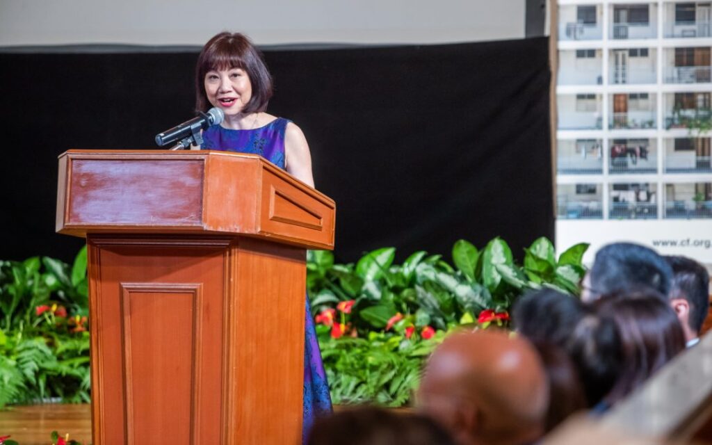 CEO Catherine Loh giving a speech