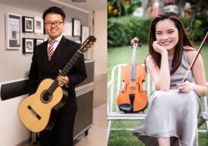 Two musicians, a man and a woman, engrossed in playing the violin and guitar.