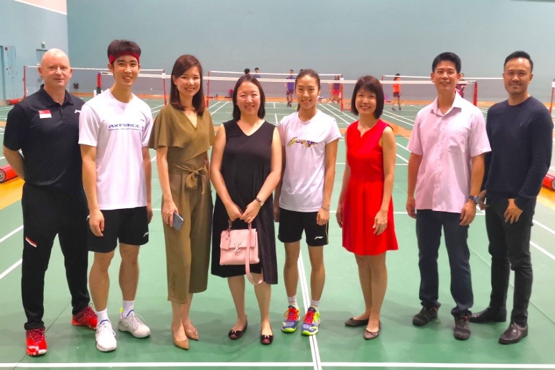 Singapore Badminton Players Loh Kean Kew and Yeo Jia Min posing with donor Karim Family Foundation at badminton court